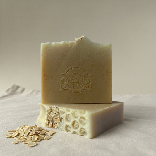 Two bars of soap with Goodland brand logo on linen