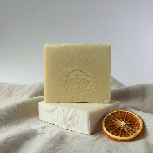Two bars of soap stacked on a gray background with Goodland brand logo.