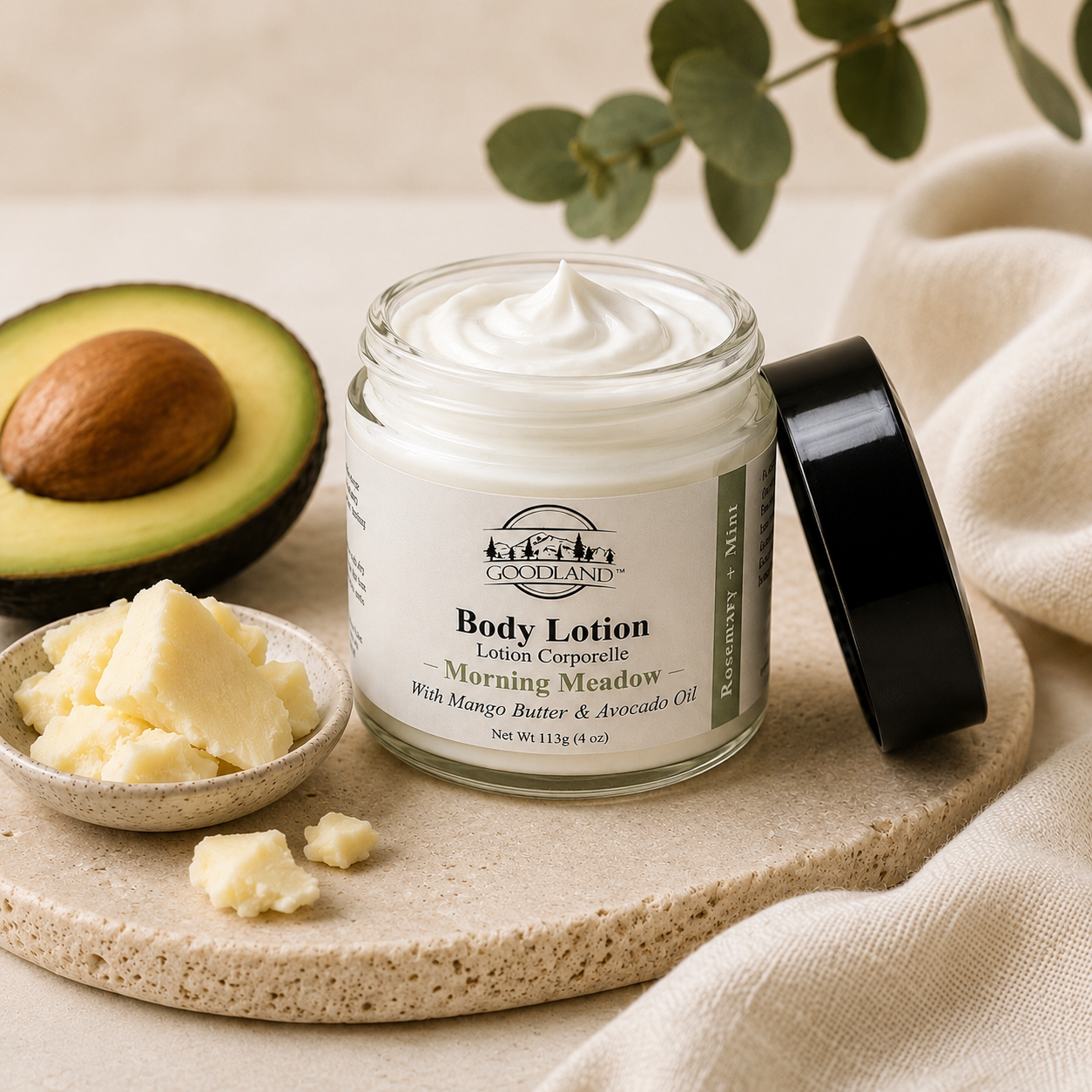 Goodland body lotion jar on flat stone with ingredients on neutral background