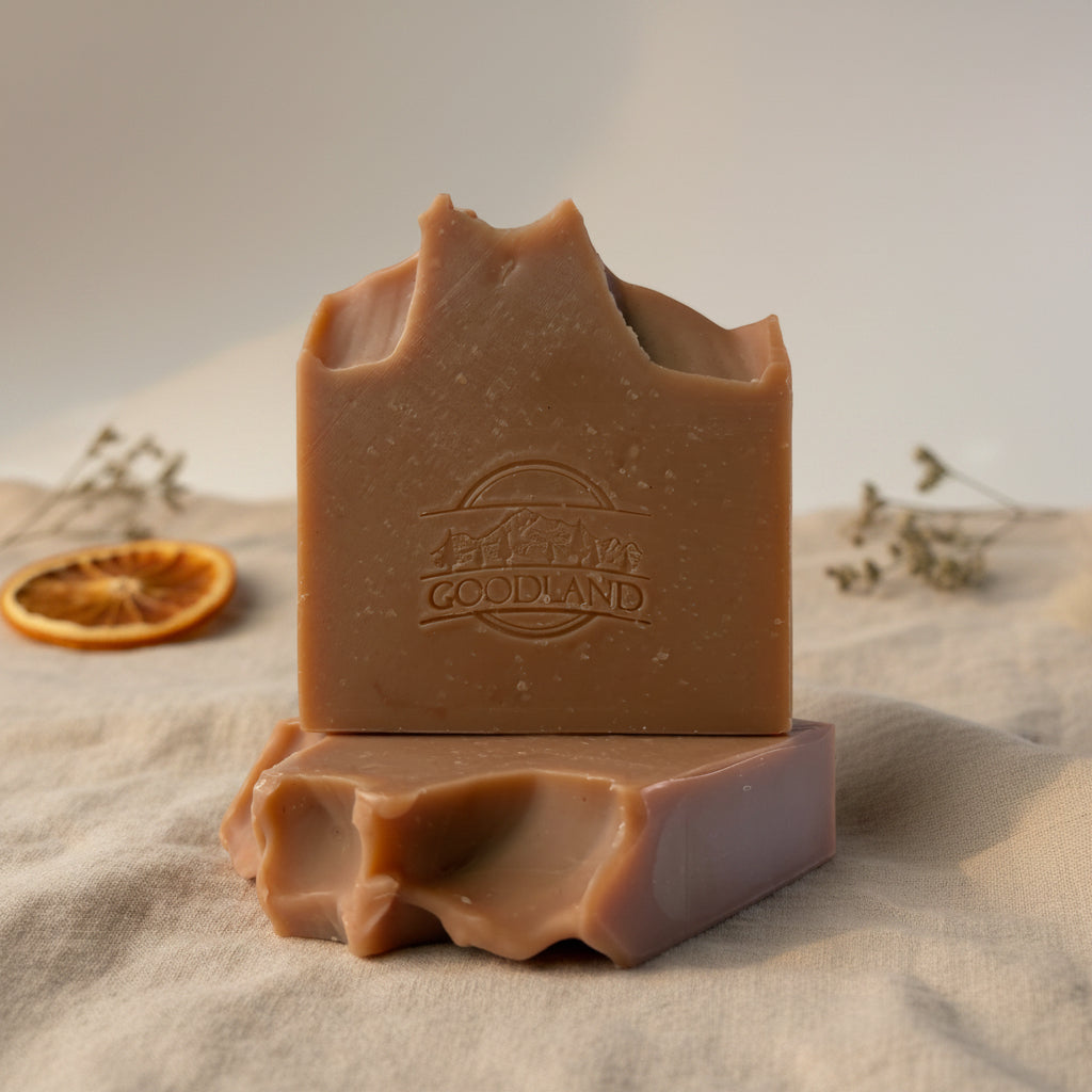 Radiant Earth Patchouli Orange Soap Bars on white background with Orange slices and patchouli leaves